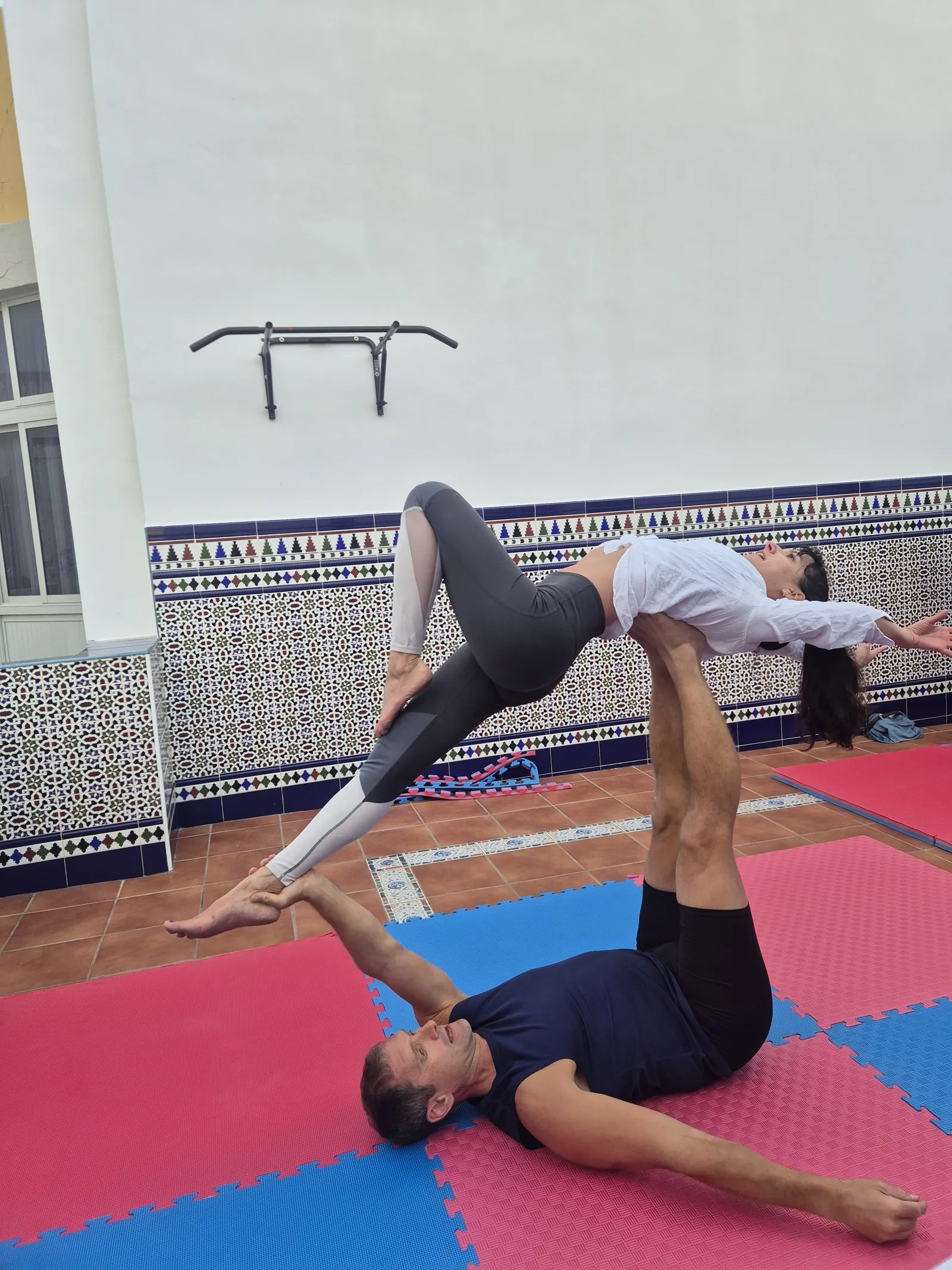 Acro Yoga at Sport rooftop terrace - whale pose