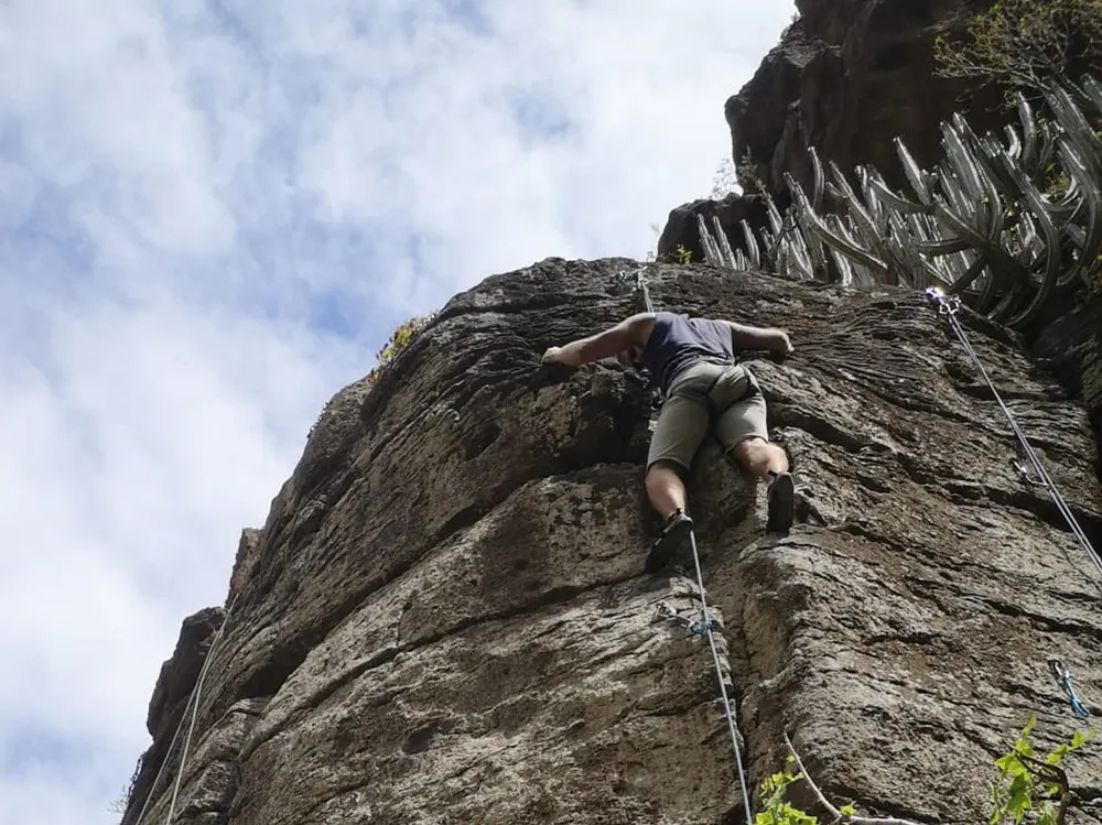 Sport climbing on volcanic rock at Costa de Arucas, north Gran Canaria