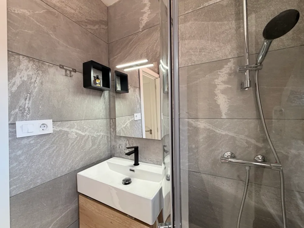 First bathroom at P21 Outpost - shower, washbasin