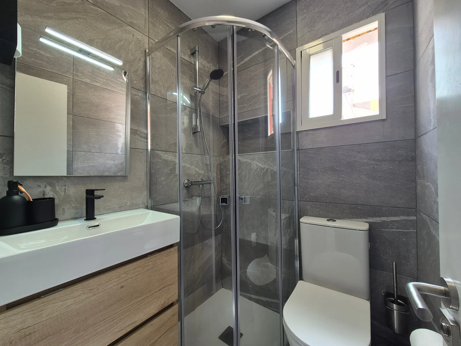 First bathroom at P21 Outpost - window, shower, toilet