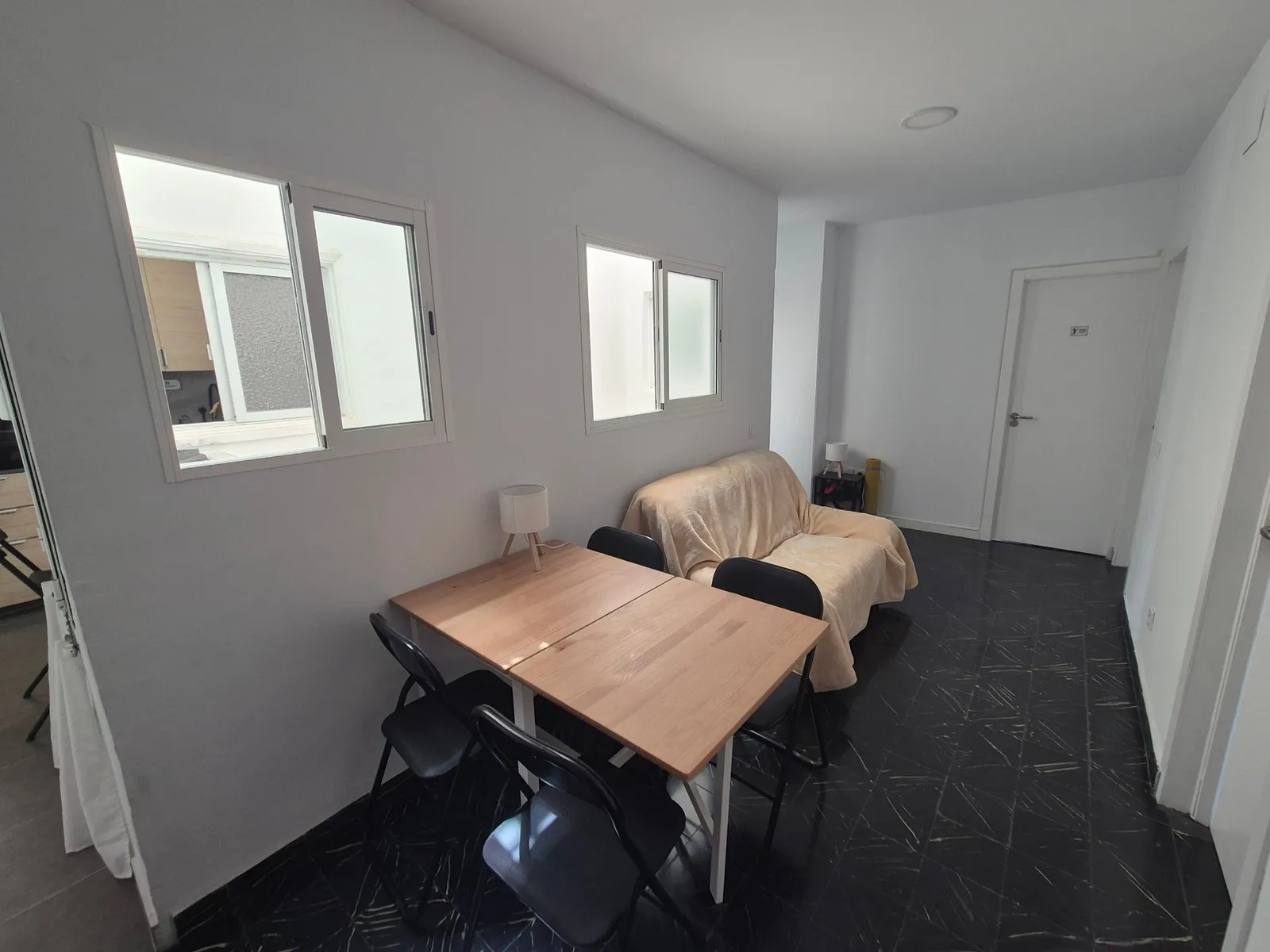 Hallway at P21 Outpost - dining table, sofa