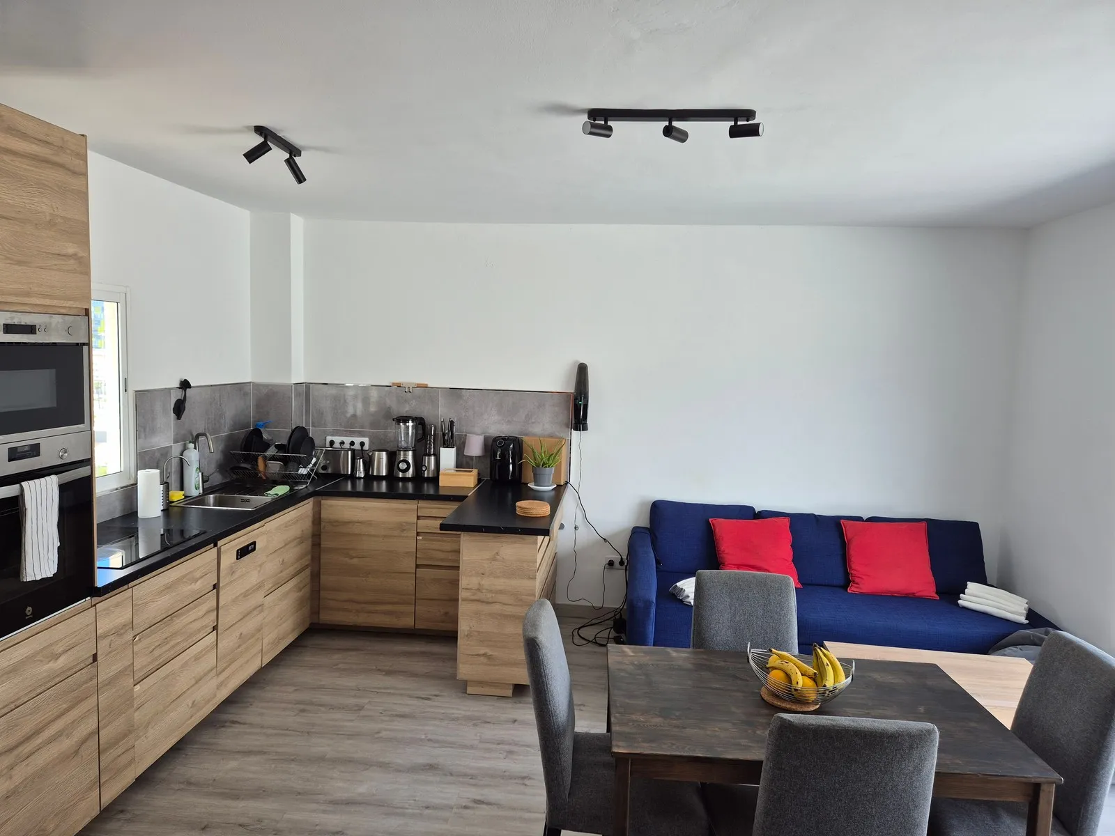 Kitchen and living room at J48 Penthouse - bright
