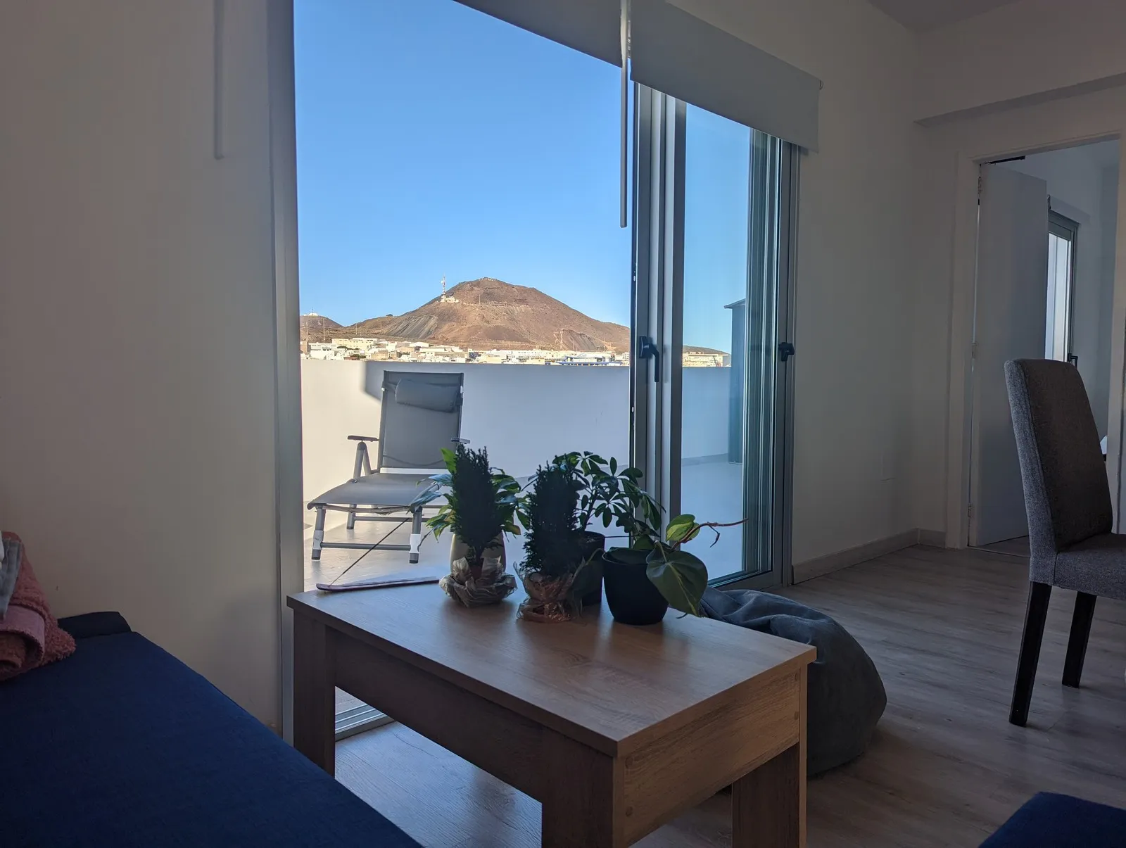 Kitchen and living room at J48 Penthouse - mountain view, sofa, sunbed