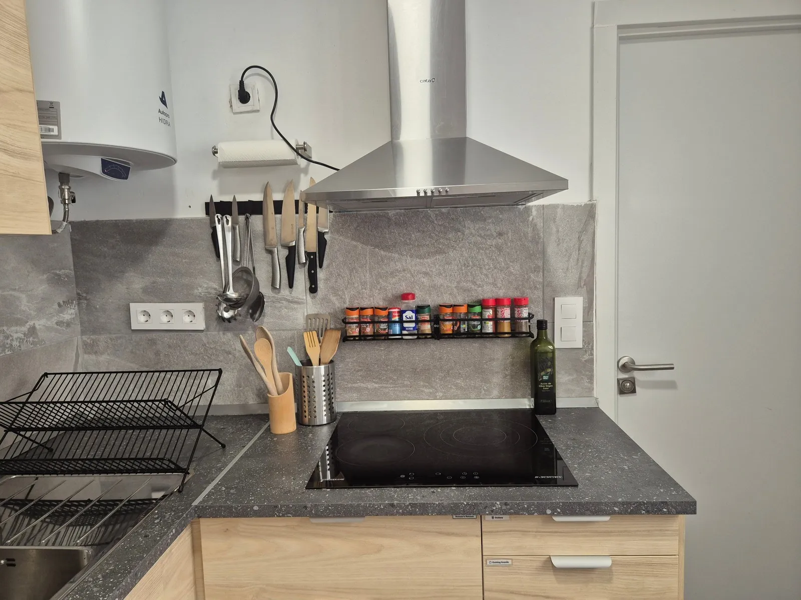 Kitchen at P21 Outpost - stove, spice rack, knife block, paper towel holder