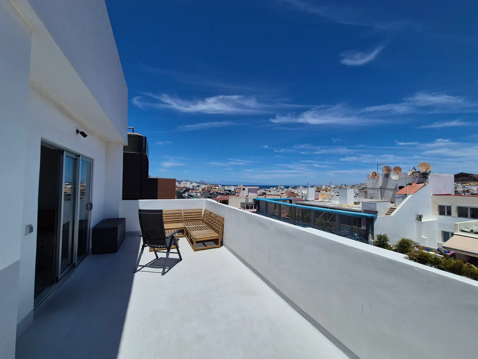Northern terrace at J48 Penthouse - blue sky