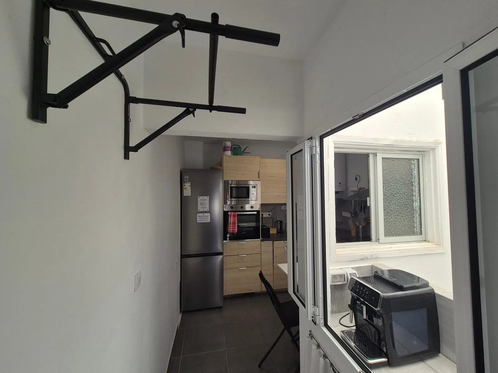 Pull-up coffee hallway at P21 Outpost - pull-up bar, kitchen