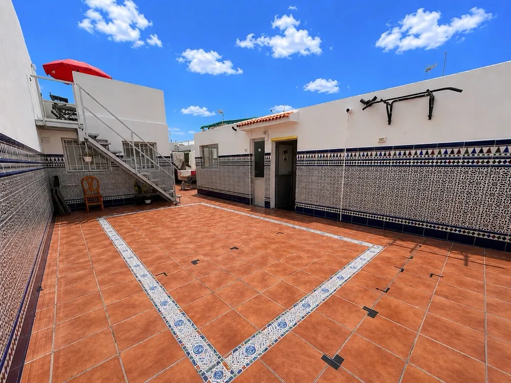 Sport rooftop terrace at U32 Headquarter - blue sky, pull-up bar, parasol